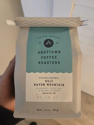 An Andytown Coffee Roasters Guji Kayon Mountain bag held in hand.